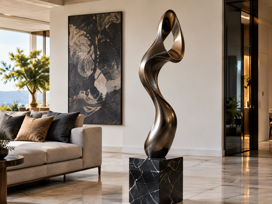 Twisting bronze sculpture on a dark pedestal in a living room.