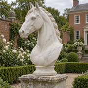 Alabaster Vigil white marble classical horse bust sculpture displayed in a Kentucky manor garden.