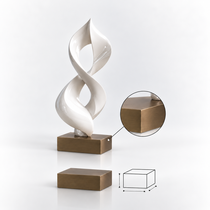 White abstract sculpture displayed on an antique bronze rectangular sculpture base