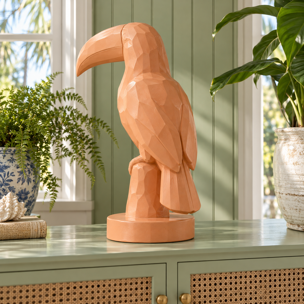 Apricot Perch, apricot fiberglass geometric toucan sculpture, rear view in Charleston sunporch pistachio beadboard cane cabinet