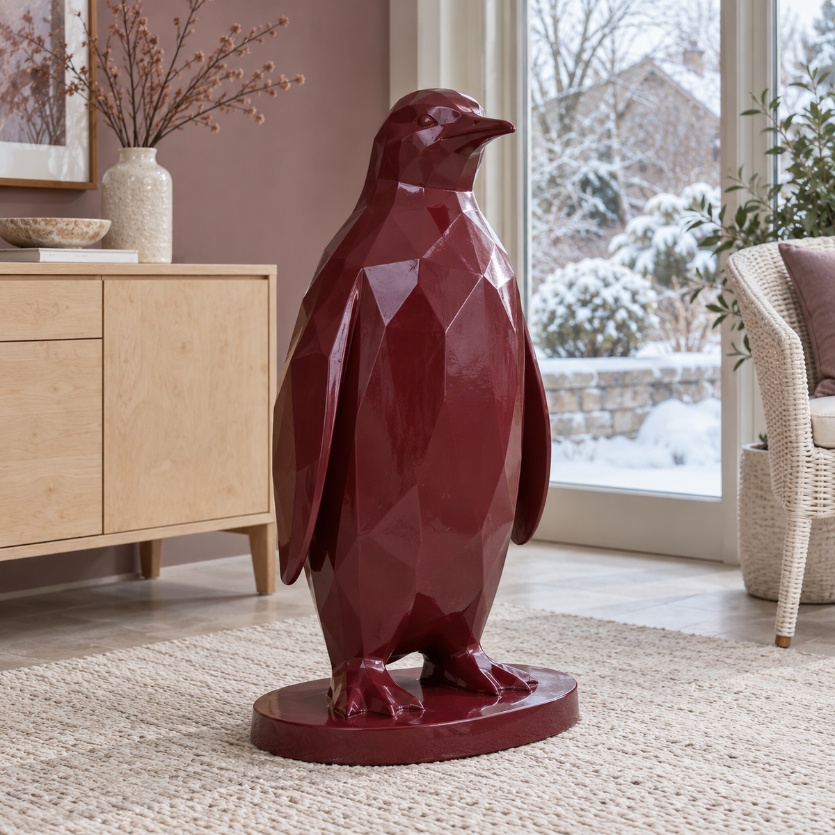Claret Huddle burgundy fiberglass geometric penguin sculpture in natural daylight.