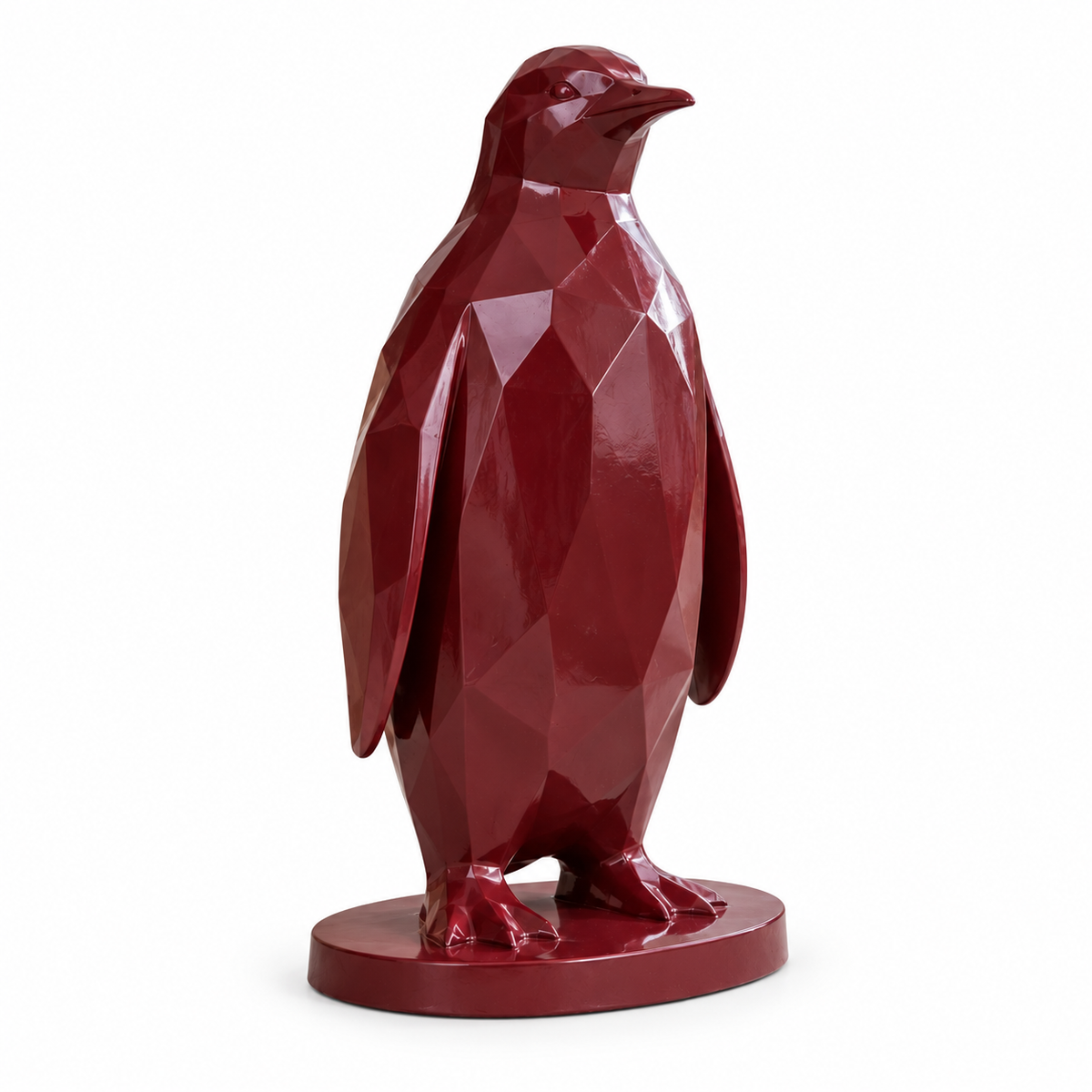 Claret Huddle burgundy fiberglass geometric penguin sculpture isolated on a pure white background with a natural contact shadow.