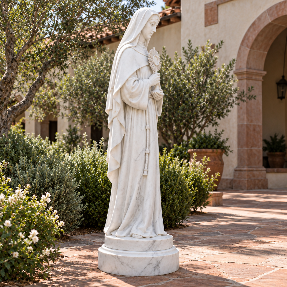 Cloister Radiance, white marble saint clare with monstrance sculpture, side view in California monastery cream stucco sage reddish sandstone