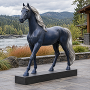 Cobalt Passage midnight-blue fiberglass walking horse sculpture displayed in an Oregon riverside terrace.