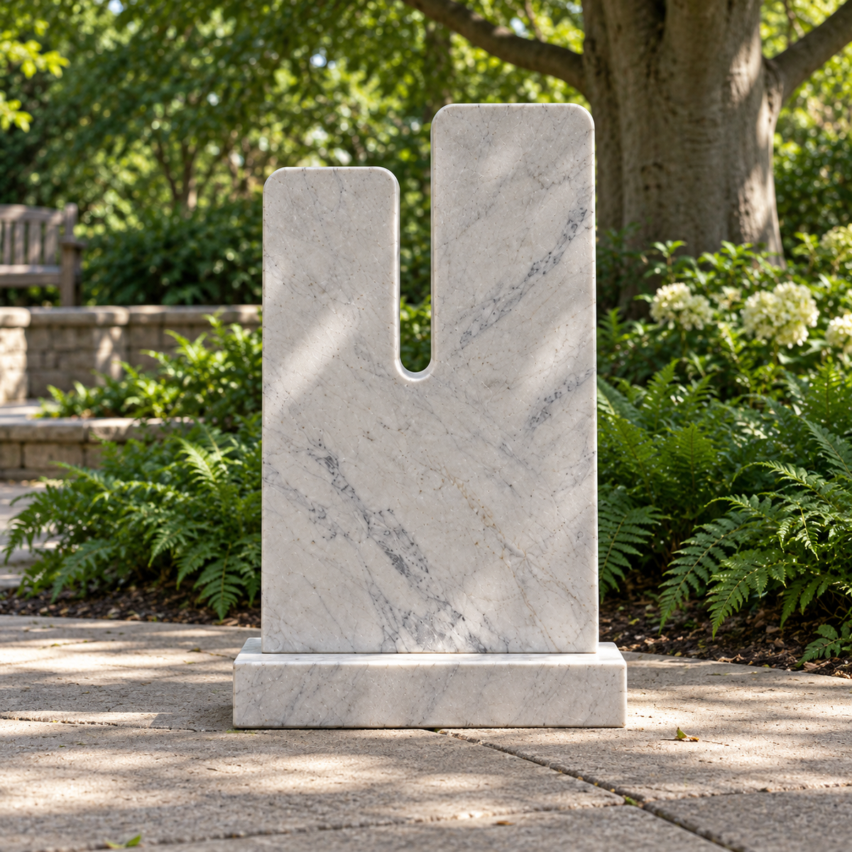 Rear view of Daybreak Cleft white marble minimalist notched memorial sculpture, showing its back and base.