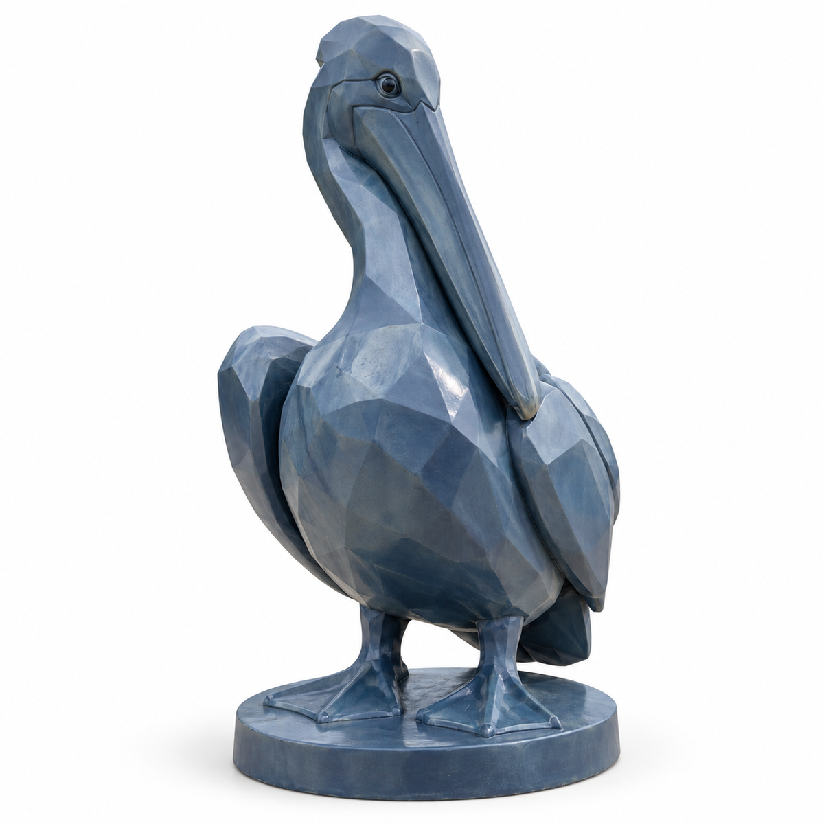 Harbor Patience slate blue fiberglass geometric pelican sculpture on a pure white background with its base and natural contact shadow.