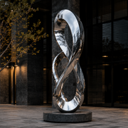 Infinite Connection large mirror stainless steel infinity loop sculpture displayed in a modern outdoor public space