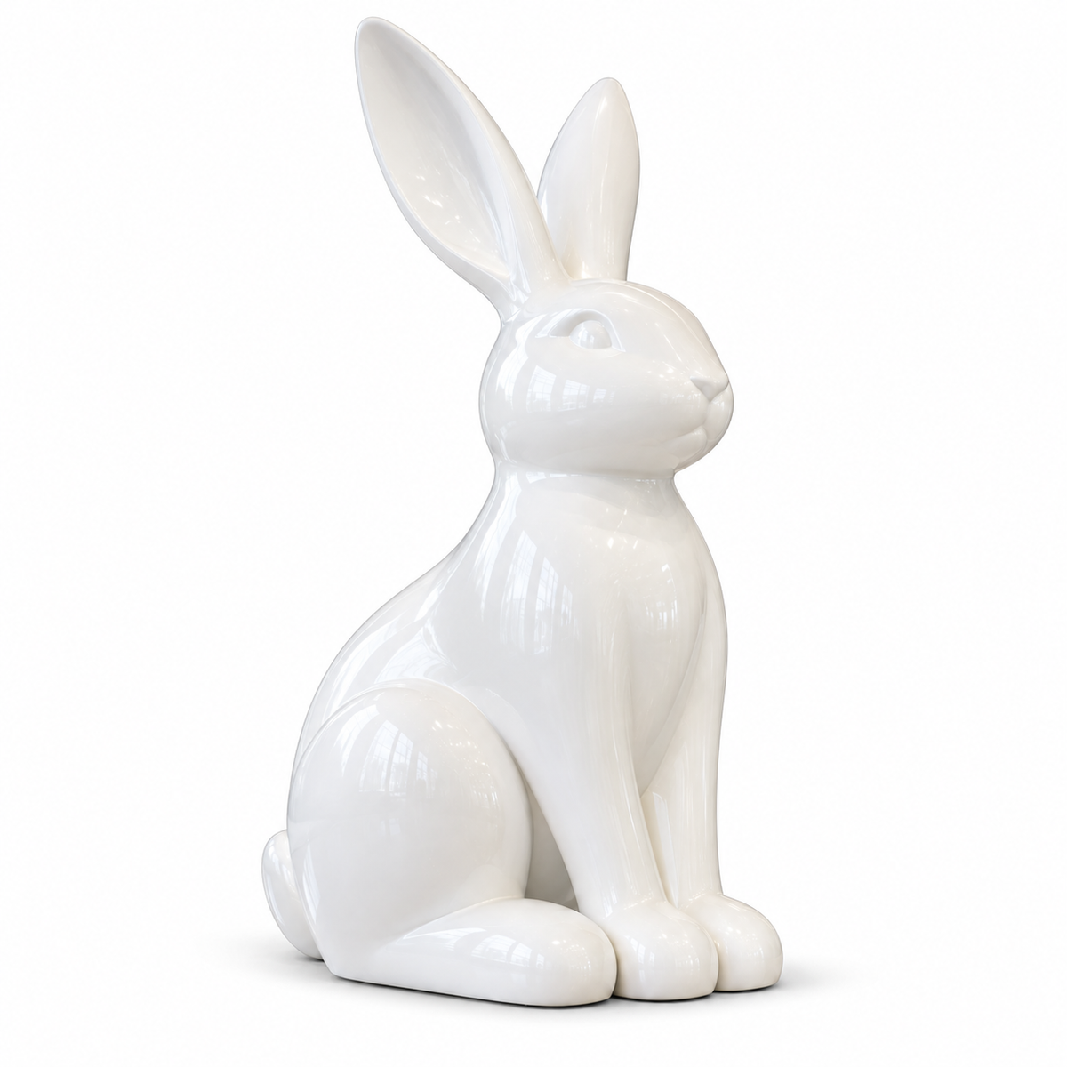 Glossy white fiberglass sitting rabbit sculpture with upright ears on a white background