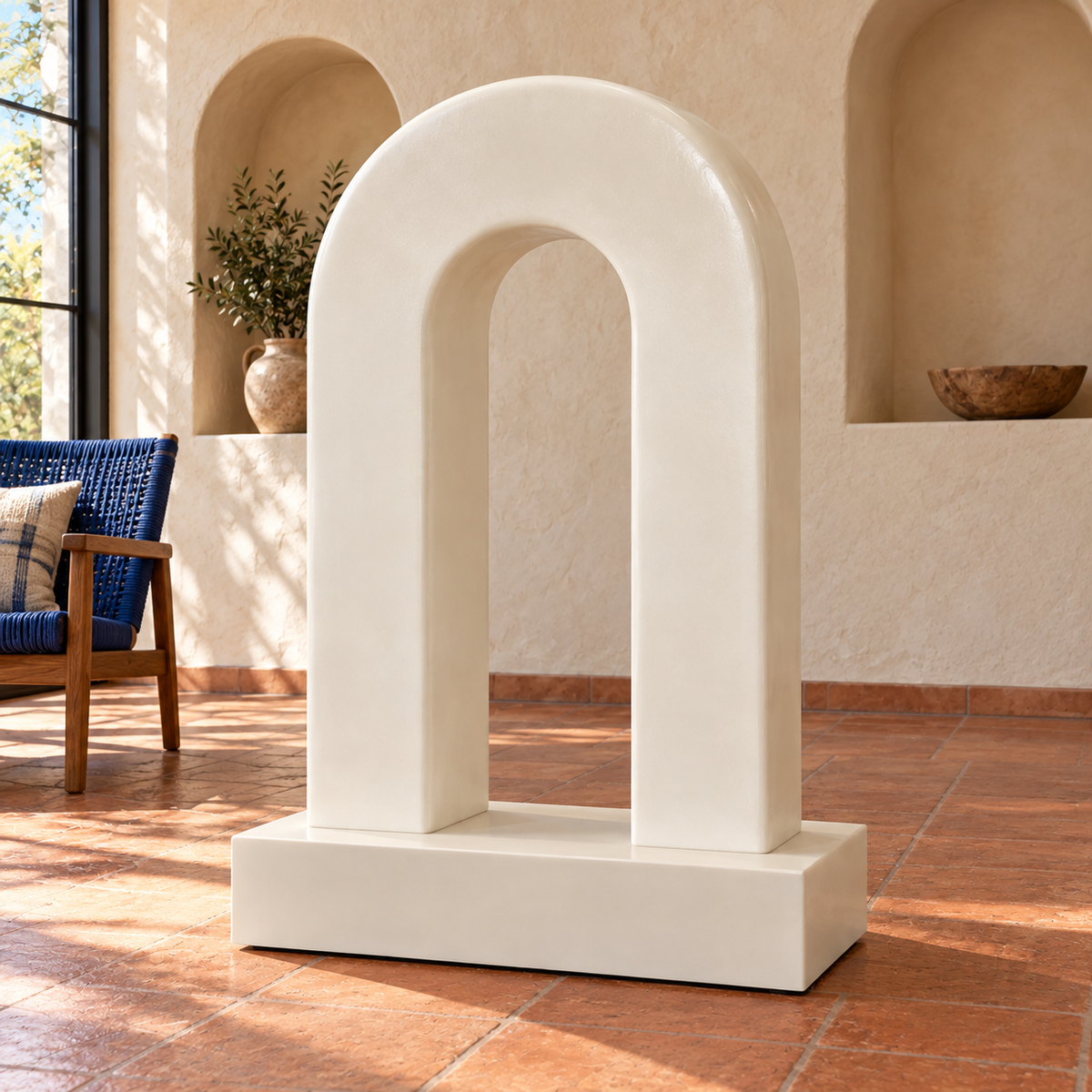 Linen Bridge, ivory fiberglass minimalist twin pillar arch sculpture, rear view in Santa Fe cream plaster niches terracotta floor blue woven chair