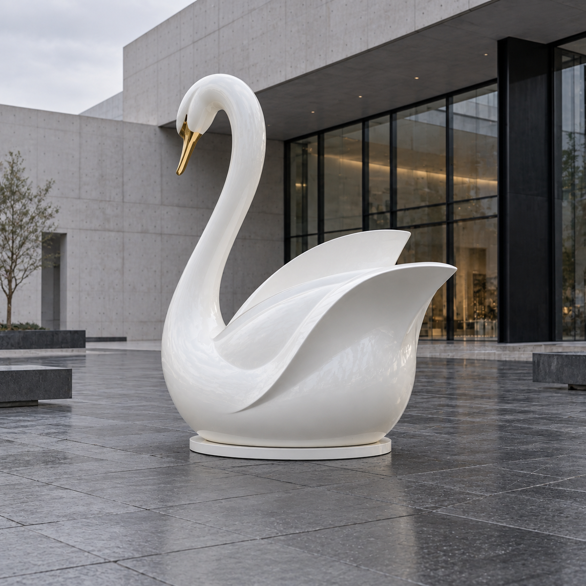 Pearl Serenade White & Gold Fiberglass Swan Sculpture — modern stone courtyard.