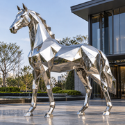 Silver Vanguard mirror stainless steel geometric horse sculpture displayed in a modern outdoor plaza